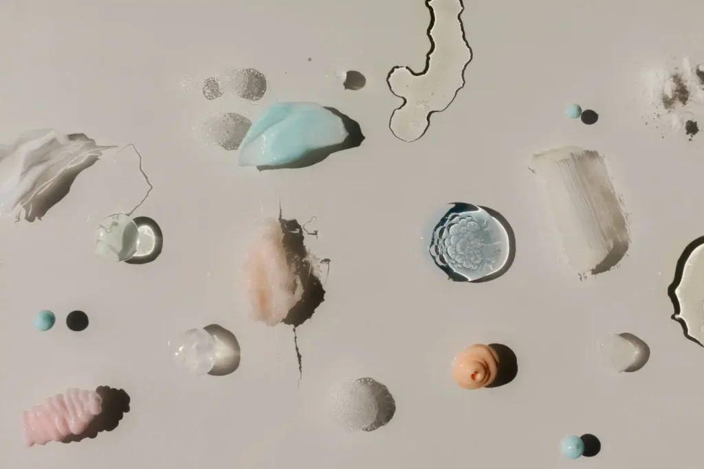 Abstract arrangement of organic textures and forms in neutral tones, representing the varied structure of collagen proteins